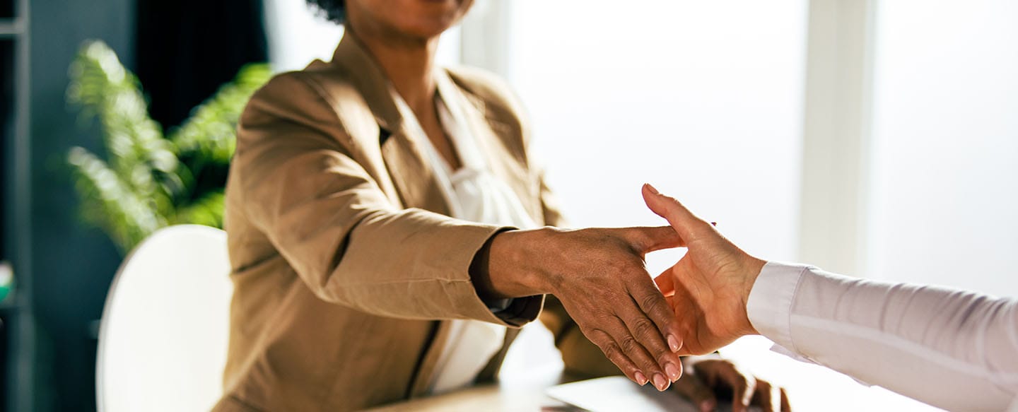 Female CEO shaking hands